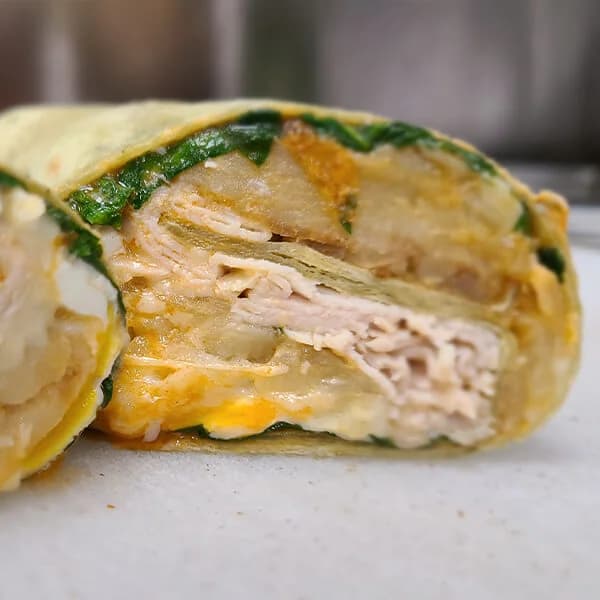 #2 Turkey, Double Egg, Spinach, Home Fries, White American, & Hot Sauce Wrap