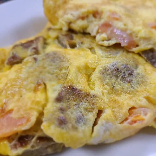 #7 Sausage, Triple Egg, Swiss, and Tomato Omelet